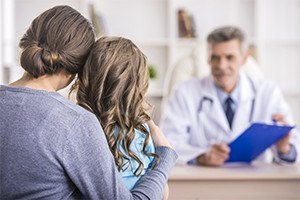 Family Attending to the Doctor