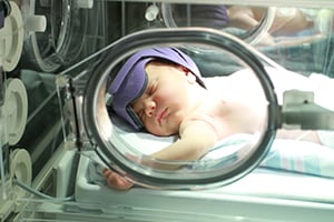 Baby on incubator